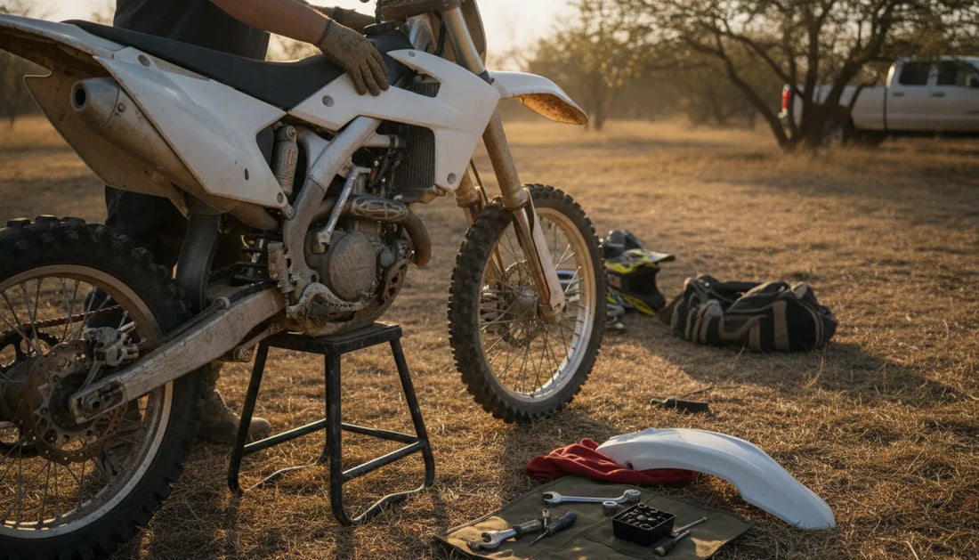 Rider fitting clean replacement plastics to a motocross dirt bike